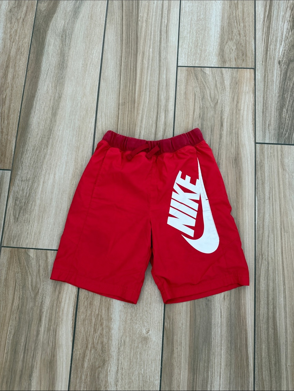 Nike Red Kids Athletic Shorts with White Swoosh